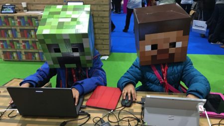 Two students build in Minecraft at BETT Conference