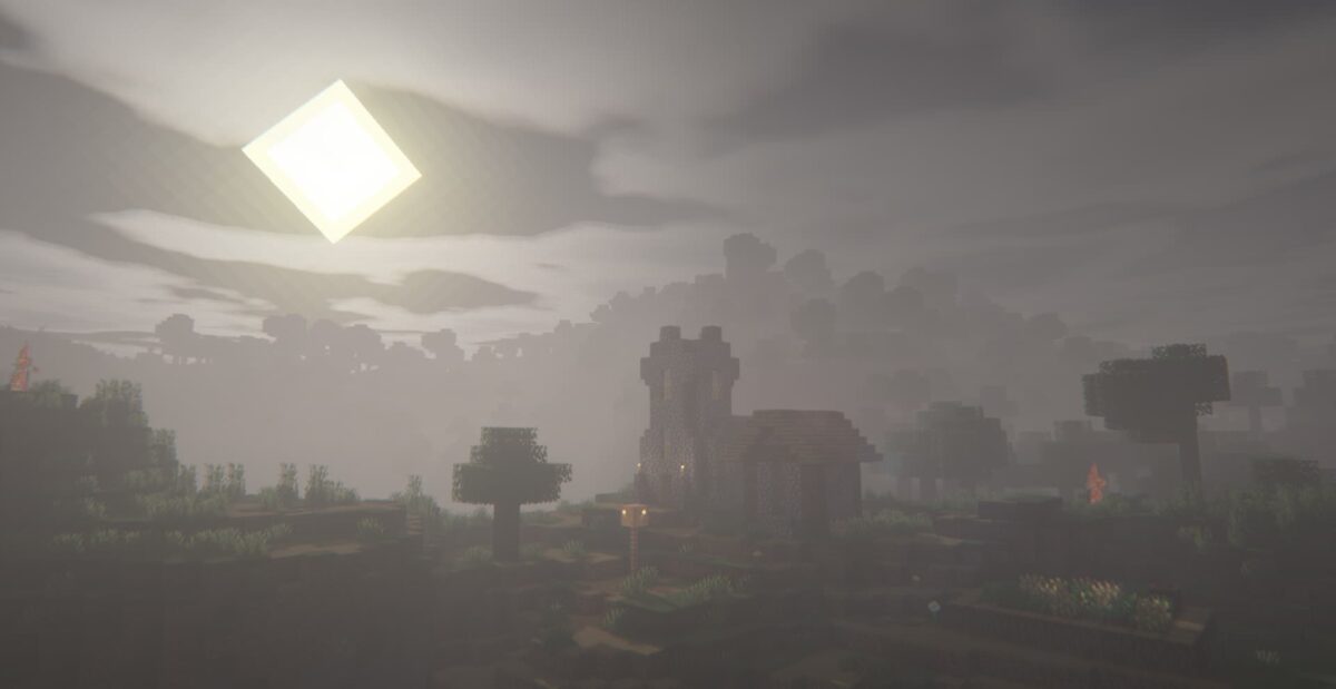 Image montrant l'effet de shader Insanity dans Minecraft, avec un paysage brumeux et un soleil carré lumineux au-dessus d'un village de pierre et d'arbres.