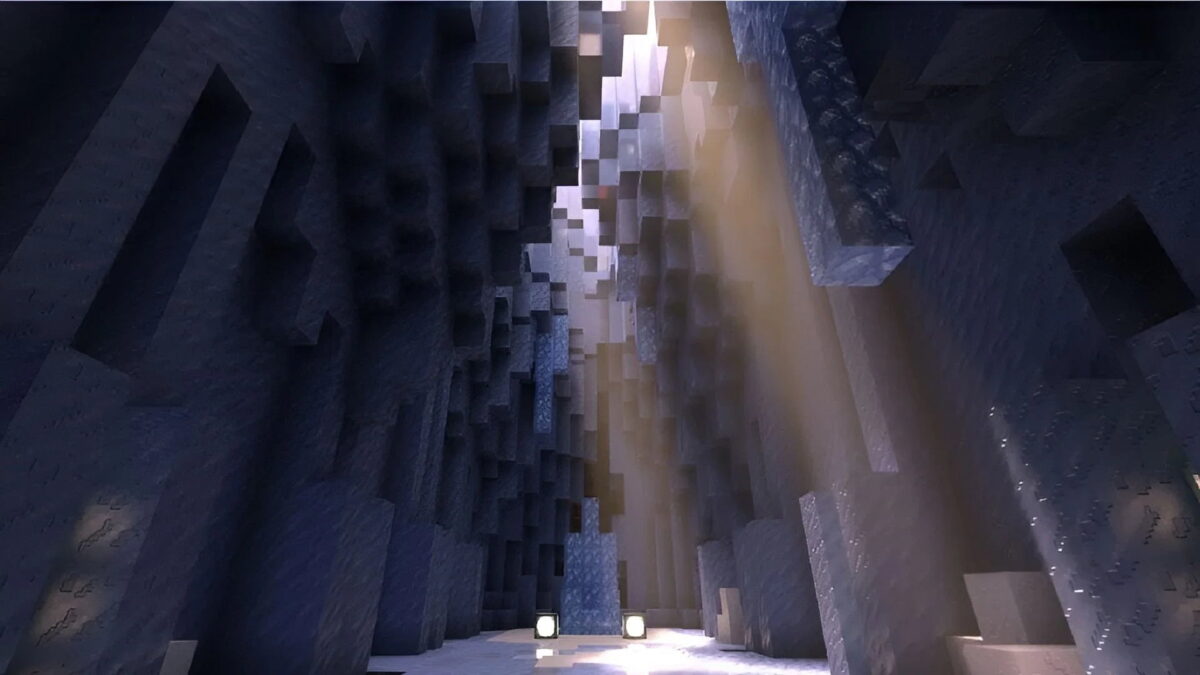 Image montrant l'effet de ray tracing dans Minecraft Bedrock Edition grâce au moteur RenderDragon, avec des jeux de lumière réalistes dans une caverne sombre