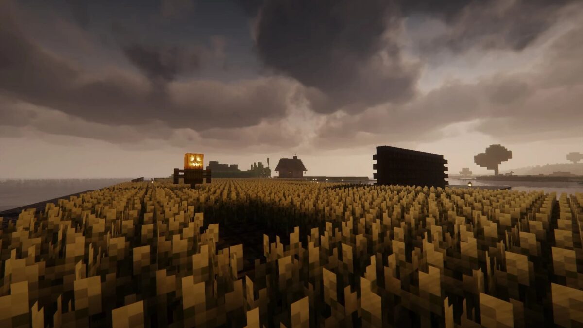 Minecraft Spooklementary shader, champ de blé sous un ciel orageux avec une Jack O' Lantern illuminée