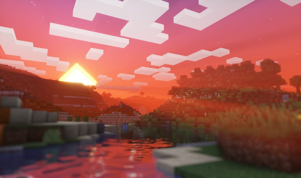 Scène de coucher de soleil au bord d’une rivière dans Minecraft avec le shader DrDestens MCShaders, offrant des couleurs chaudes et des reflets naturels.