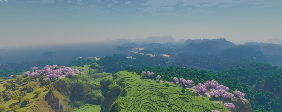 collines verdoyantes et cerisiers en fleurs sous un ciel clair, bloop shaders minecraft