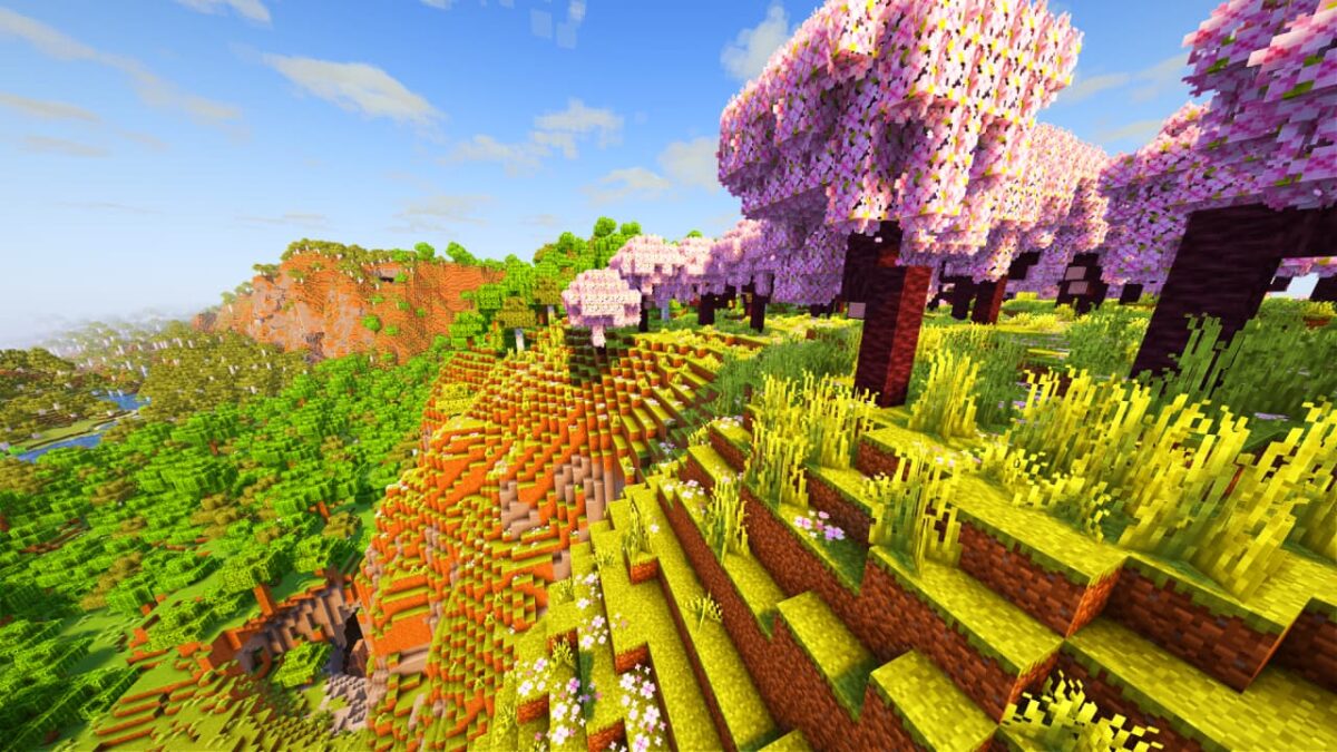 collines avec des cerisiers en fleurs dans Minecraft, éclairées par Aurora's Shaders avec des couleurs douces et un ciel dégagé.