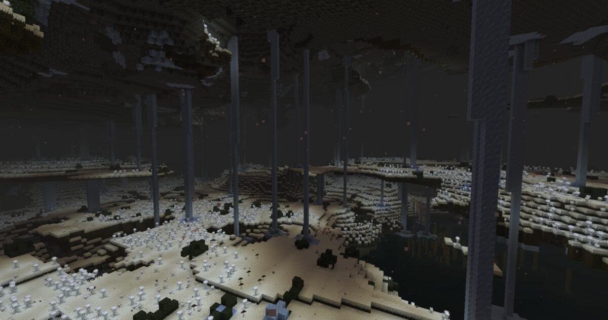 Frostfields dans le mod The Undergarden Minecraft, vaste étendue glacée avec piliers massifs dans une caverne froide