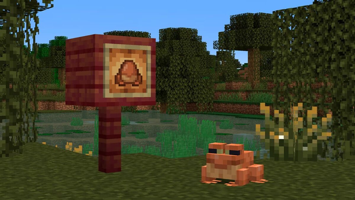 Œuf d’apparition de grenouille dans Minecraft, placé sur un panneau en pleine nature.