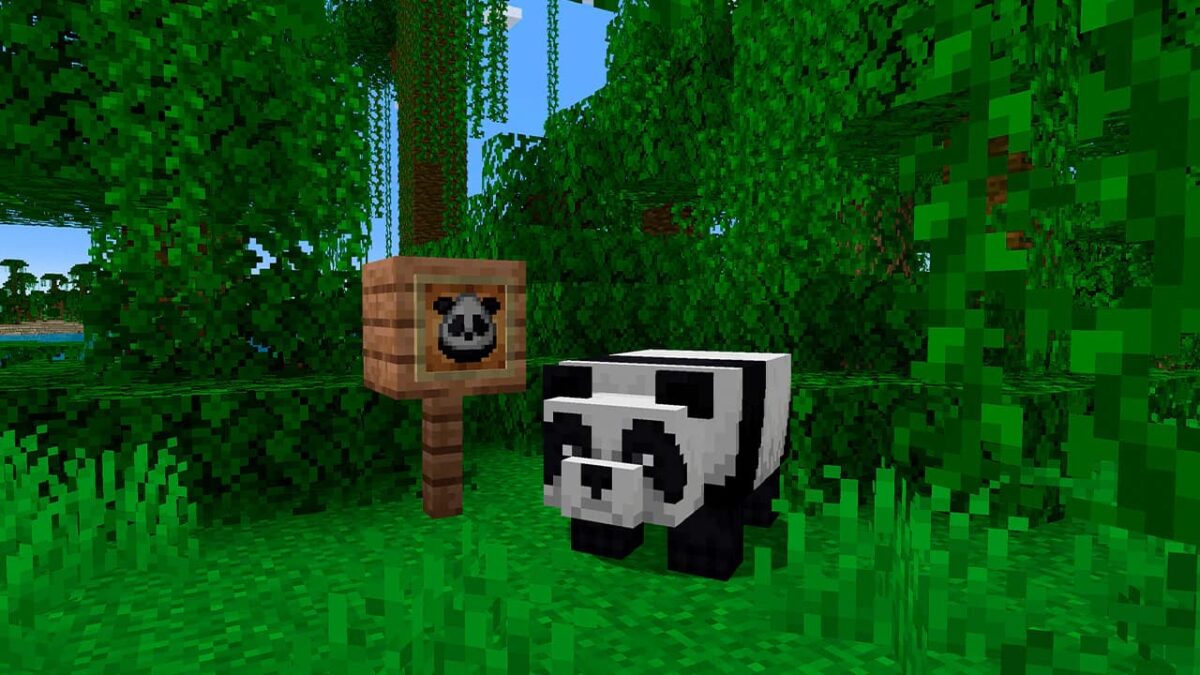 Un panda dans la jungle à côté de son œuf d’apparition dans Minecraft