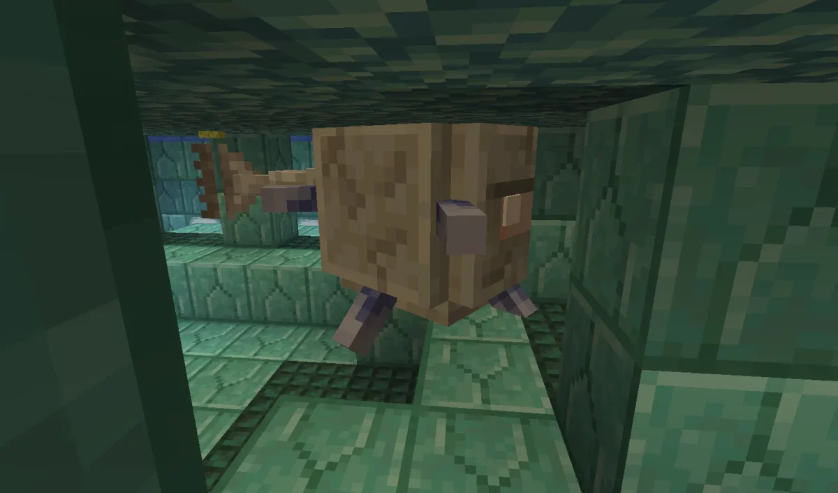 Grand gardien apparaissant dans une salle d’un monument sous-marin en Minecraft.