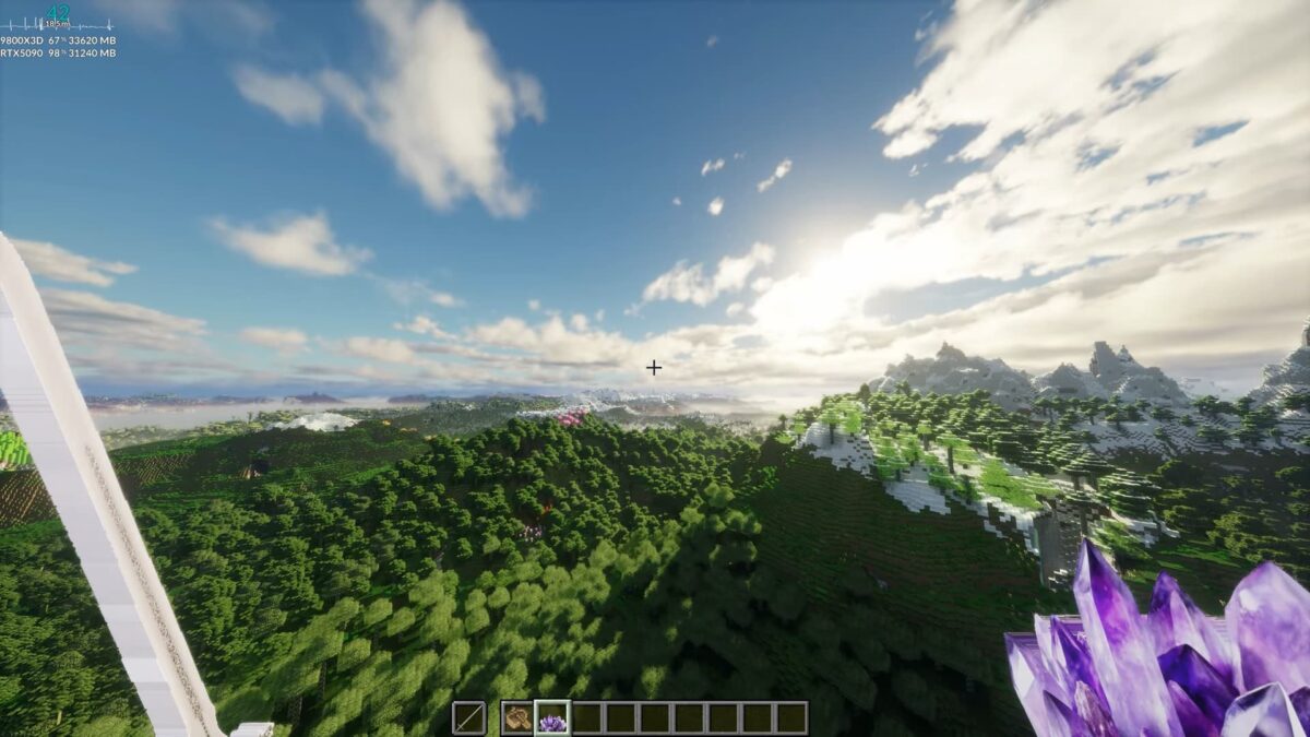 Vue à distance ultra-élevée sur montagnes et forêts dans Minecraft avec shaders réalistes et ciel dynamique.
