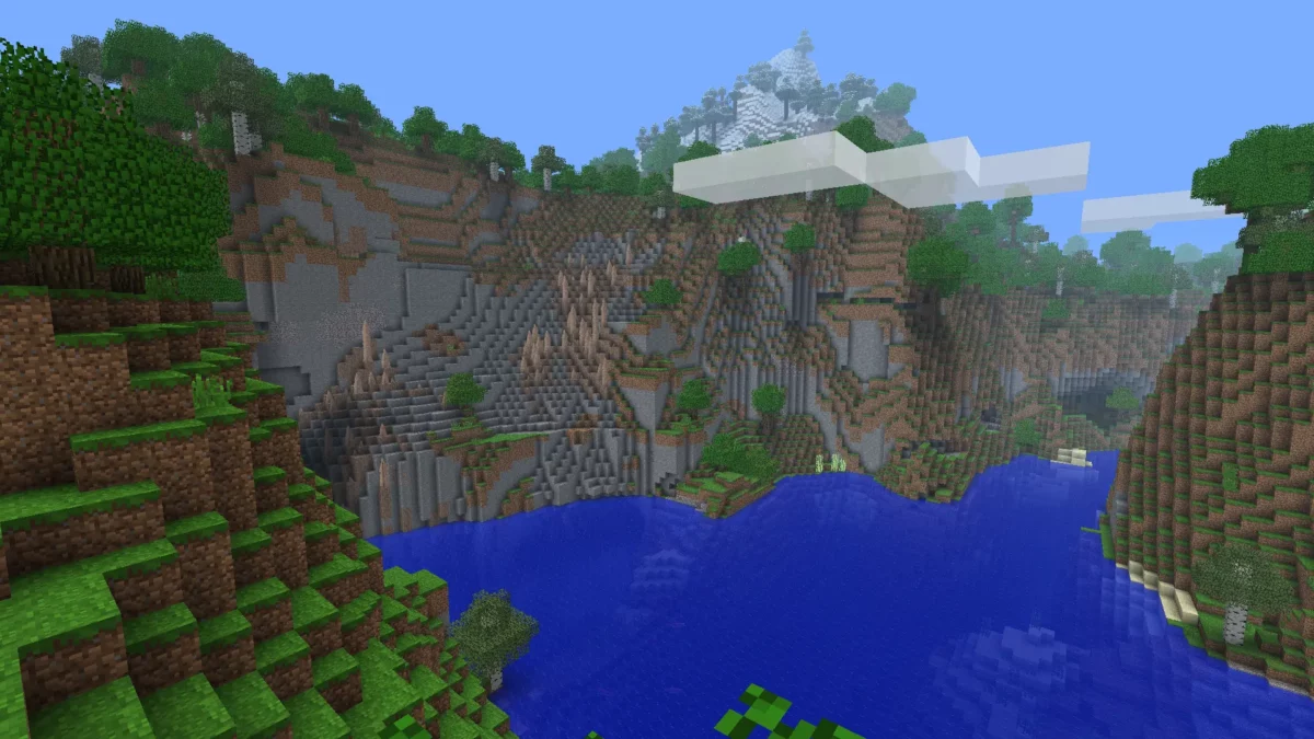 paysage montagneux rétro avec lac bleu et falaises dans Minecraft avec le pack de textures Golden Days