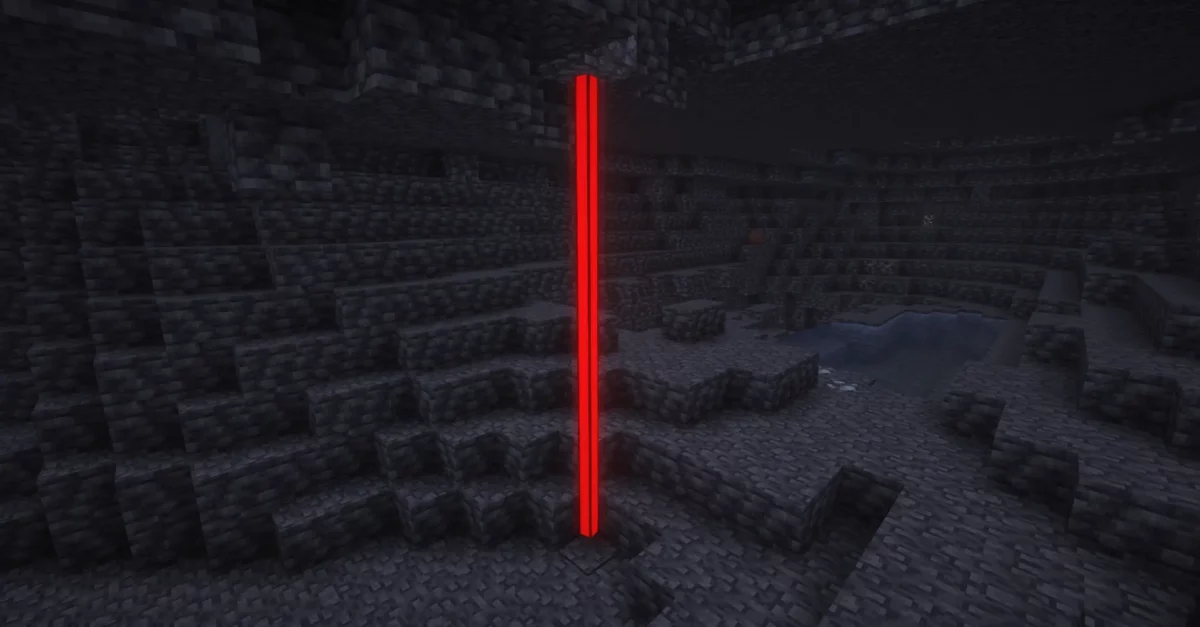 Colonne lumineuse rouge utilisée comme piège ou signal dans une grotte du mod Minecraft Confluence: Otherworld.