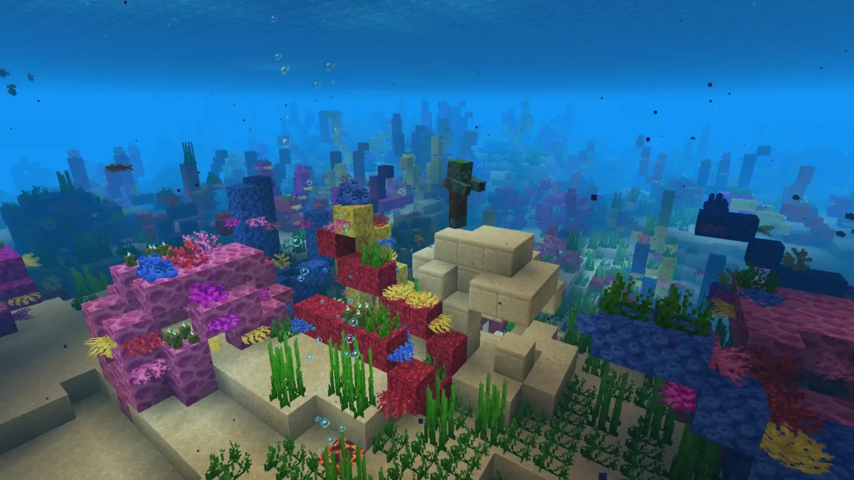 Ruine chaude en grès dans Minecraft, nichée dans un récif corallien avec un noyé visible