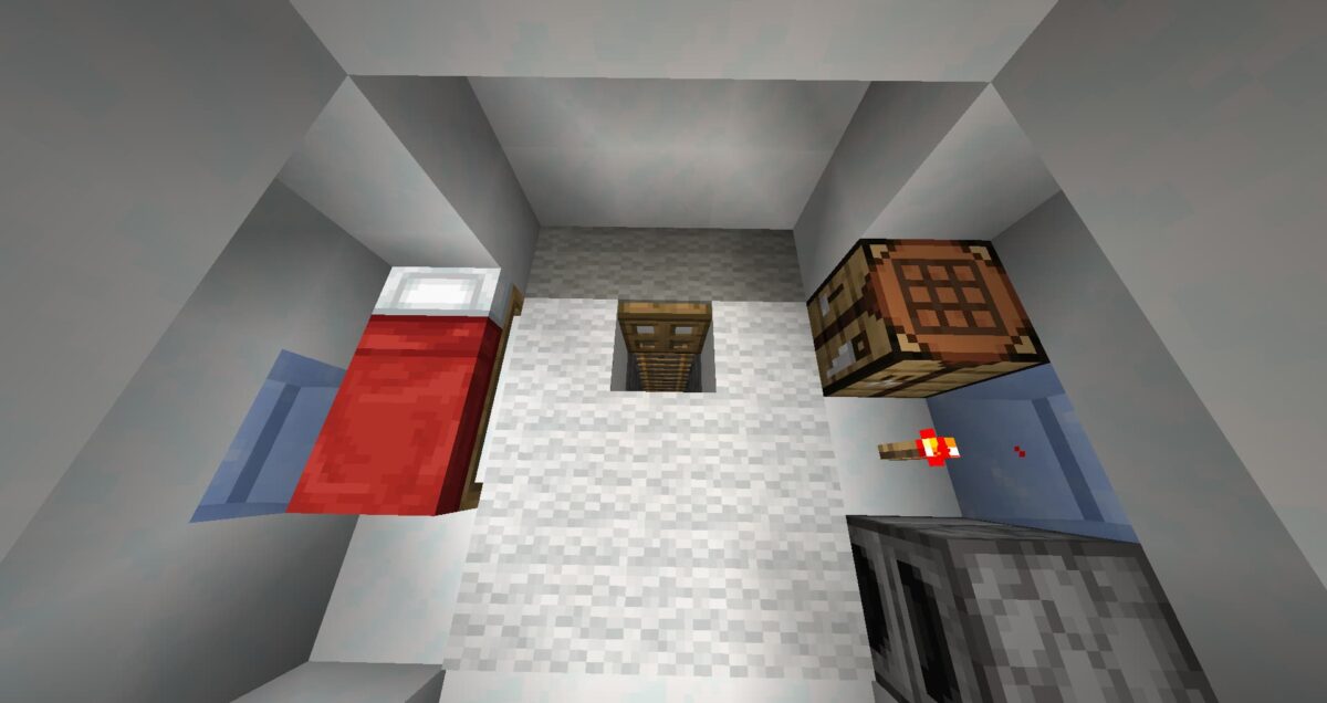 Trappe en bois dévoilée sous un tapis blanc dans un igloo de Minecraft, menant à un escalier vertical.