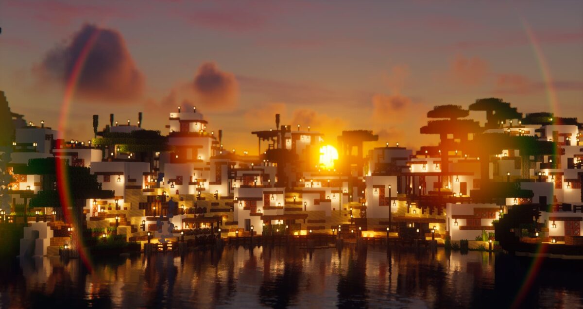 Coucher de soleil sur la Greek City map Minecraft, avec des maisons méditerranéennes blanches, des lanternes allumées et un arc-en-ciel en arrière-plan.