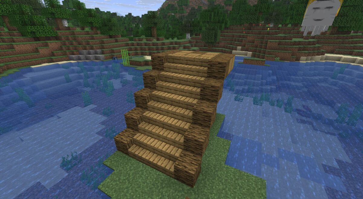 Escalier en bois complet avec renforts latéraux dans Minecraft, menant à une station pour ghasts.