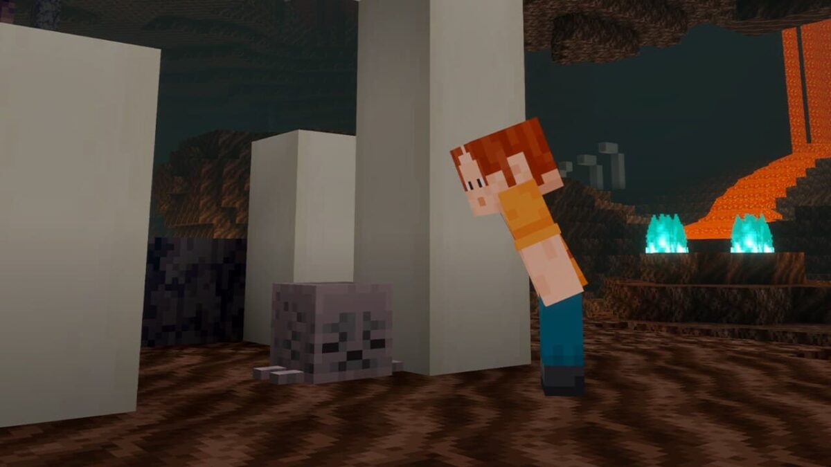 Un joueur découvre un bloc de ghast desséché à côté d’ossements dans une caverne du Nether.