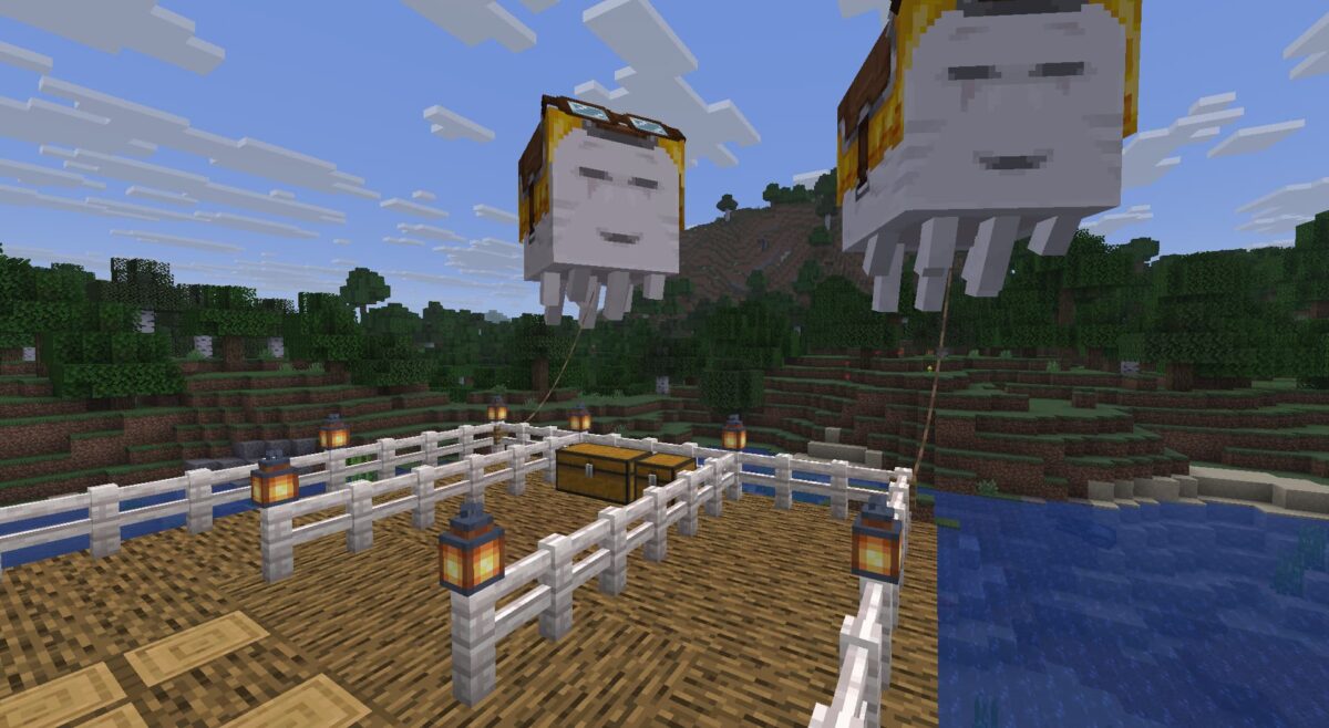 Deux ghasts joyeux attachés à une station en hauteur dans Minecraft, retenus par des laisses sur une plateforme sécurisée.