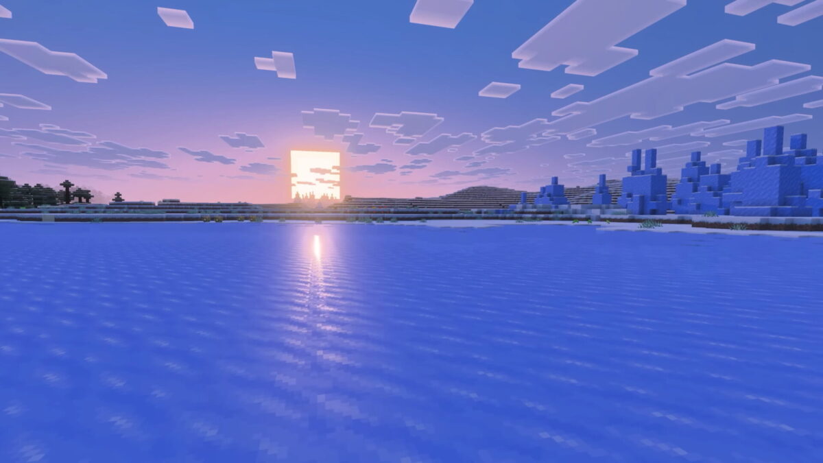 Minecraft avec Vibrant Visuals activé, reflet du soleil sur un océan gelé au coucher du soleil
