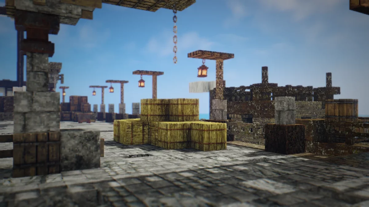 Quai en pierre dans Minecraft avec bottes de foin et lanternes, éclairé par un ciel dégagé via le shader RedHat.