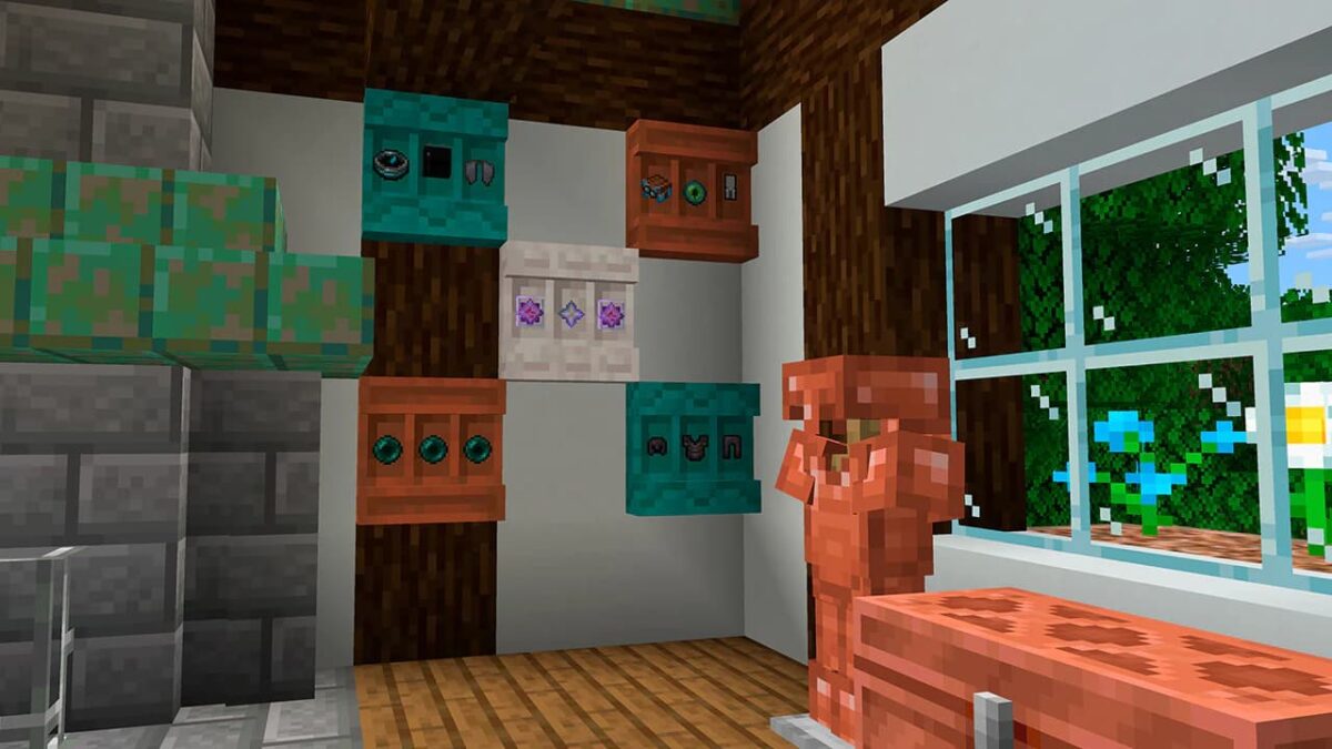 Blocs d’étagères colorés fixés au mur, contenant divers objets exposés dans une maison lumineuse en Minecraft, avec une statue de golem en cuivre à côté.