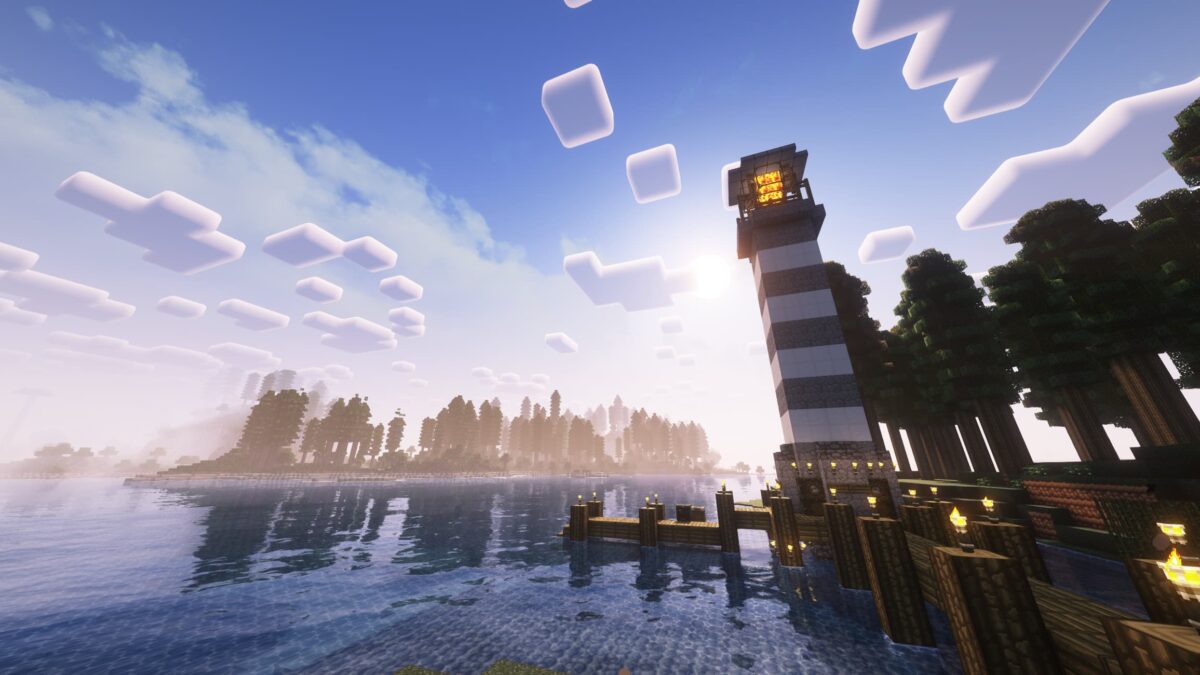 Phare en bord de mer dans Minecraft éclairé par la lumière du lever du soleil, avec le pack de textures Gerudoku Faithful et les shaders Complementary Reimagined.