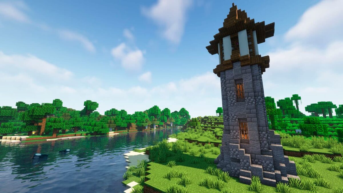 Tour de guet en pierre générée dans Minecraft par le mod Medieval Buildings, placée en bordure d’une rivière au sein d’un biome forestier.