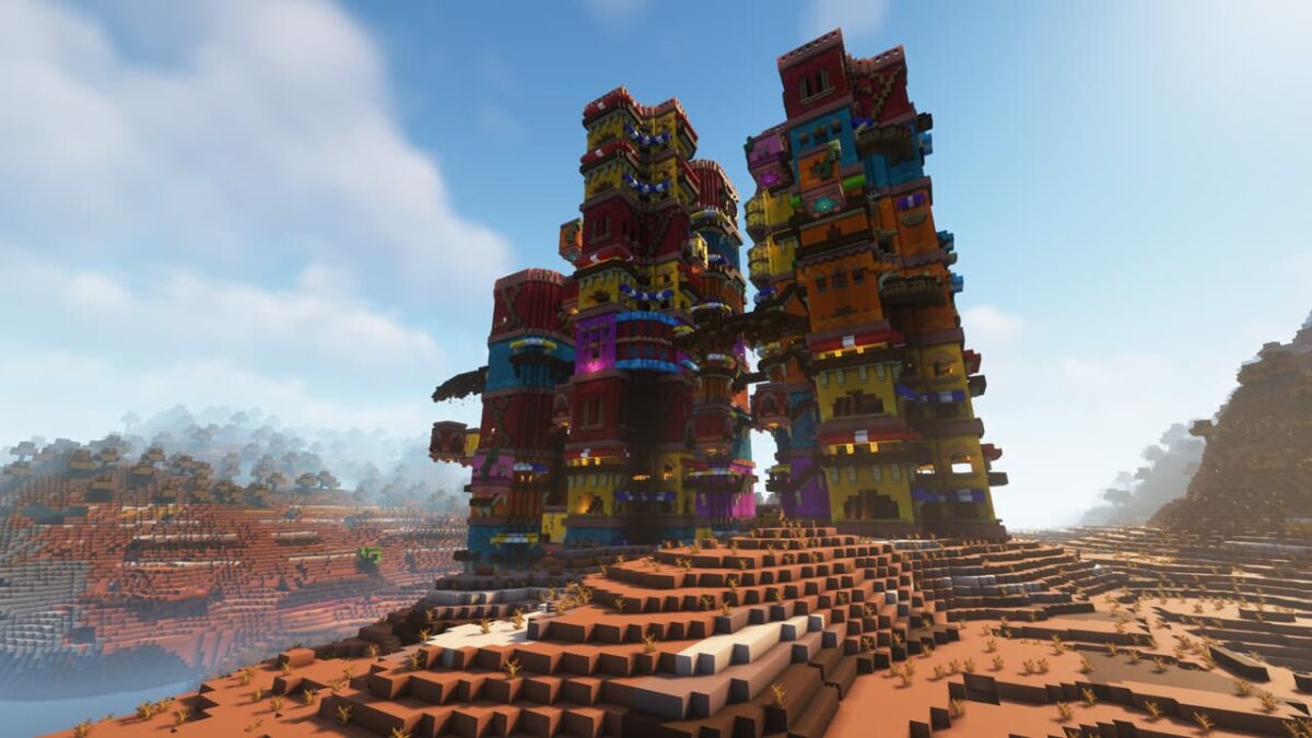 Tours empilées multicolores dans un biome mesa, campement de bandits généré par le mod When Dungeons Arise dans Minecraft.