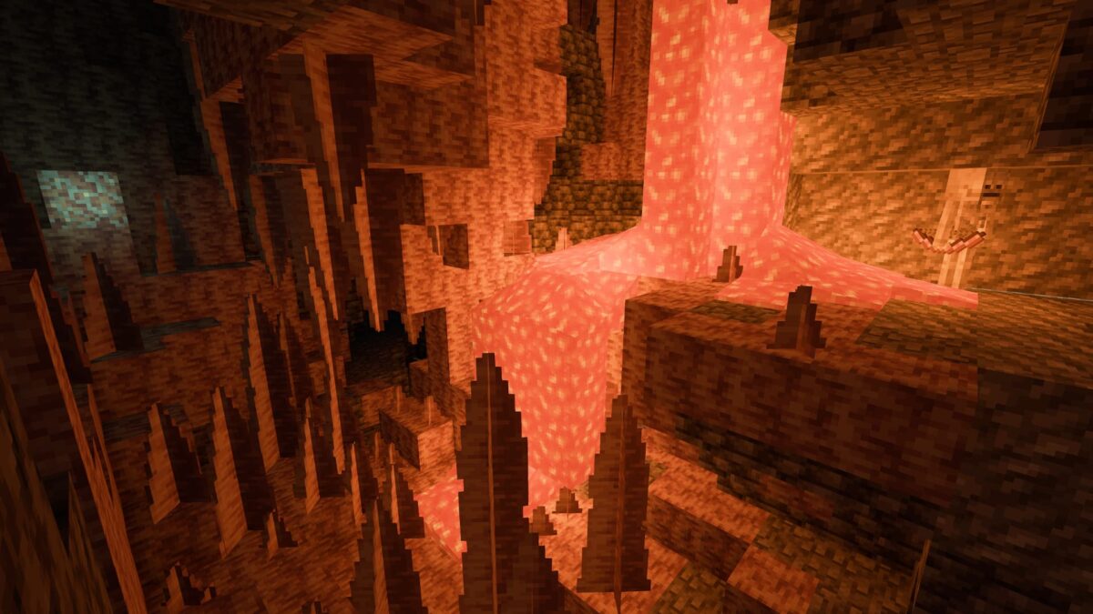 Grotte de Minecraft éclairée par une chute de lave avec des reflets lumineux réalistes sur les parois.