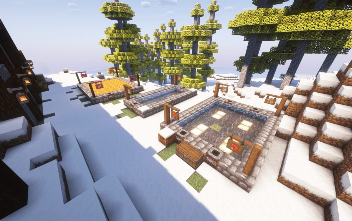 modpack Minecraft Society: Sunlit Valley avec des étangs à poissons construits dans un paysage enneigé