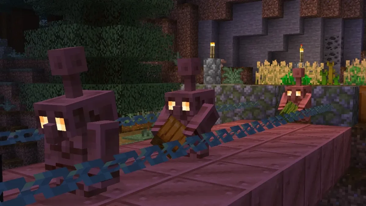 Trois golems de cuivre traversent un pont en cuivre en transportant des objets dans Minecraft 1.21.9