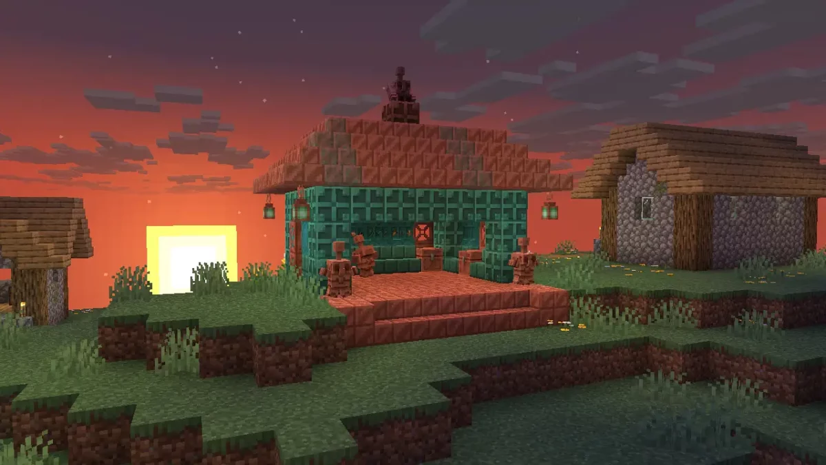 Maison construite en blocs de cuivre avec plusieurs statues de golems de cuivre dans Minecraft 1.21.9