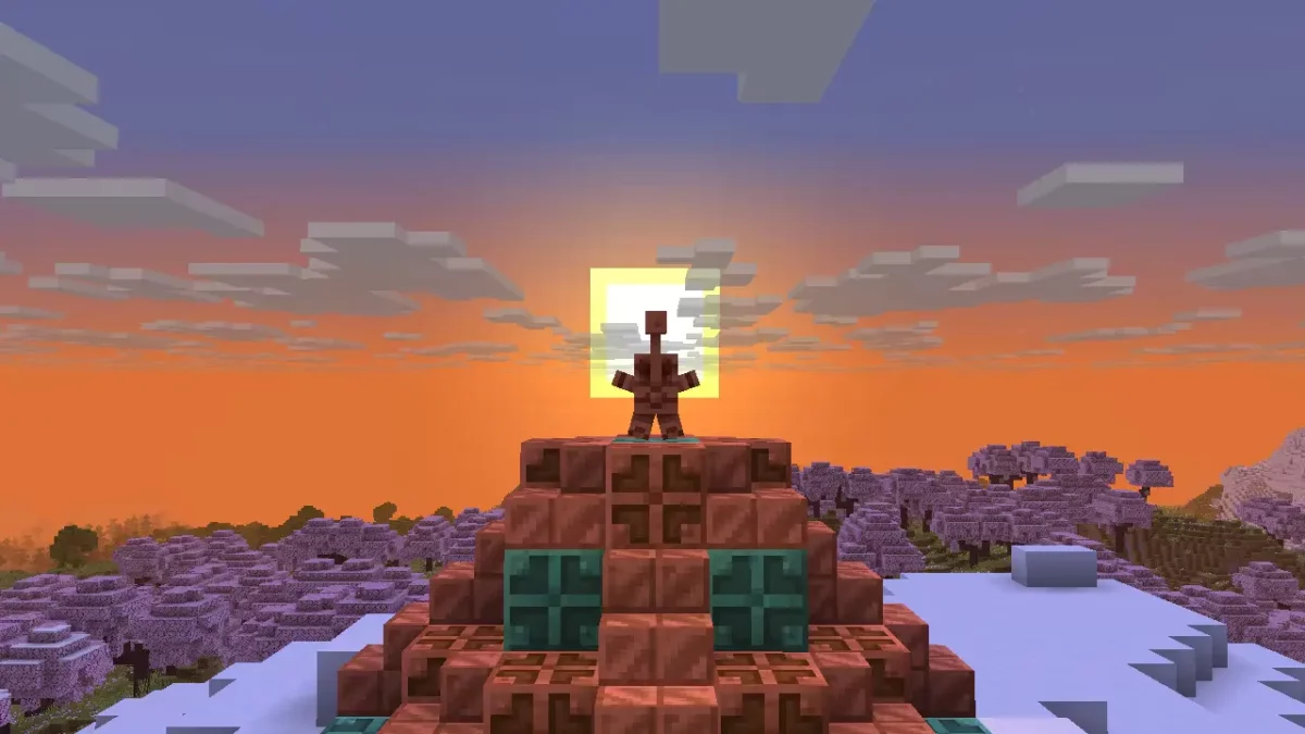 Une statue de golem de cuivre effectue la pose étoile sur un piédestal en cuivre dans Minecraft 1.21.9