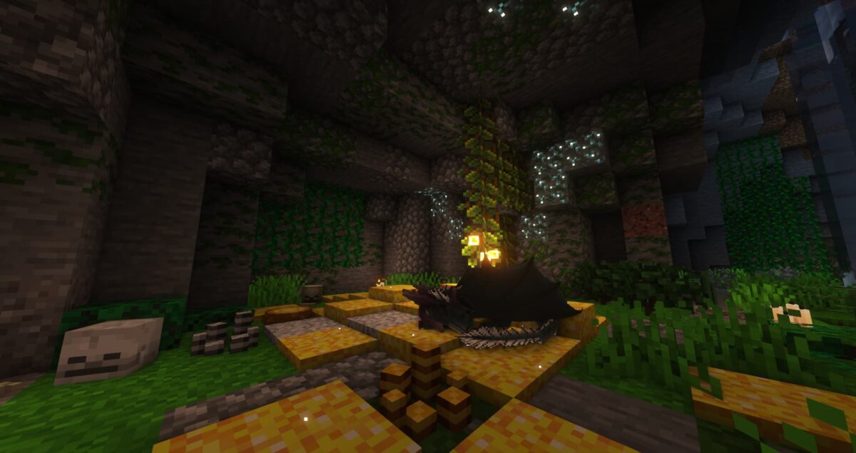 dragon couché sur son trésor doré dans une caverne dans le mod Minecraft Dragon Survival