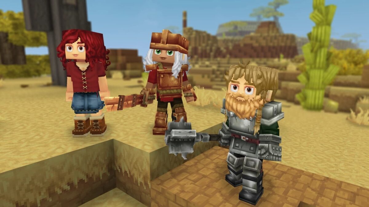 Personnages en équipement varié regroupés dans une zone désertique de Hytale, représentant une scène multijoueur.