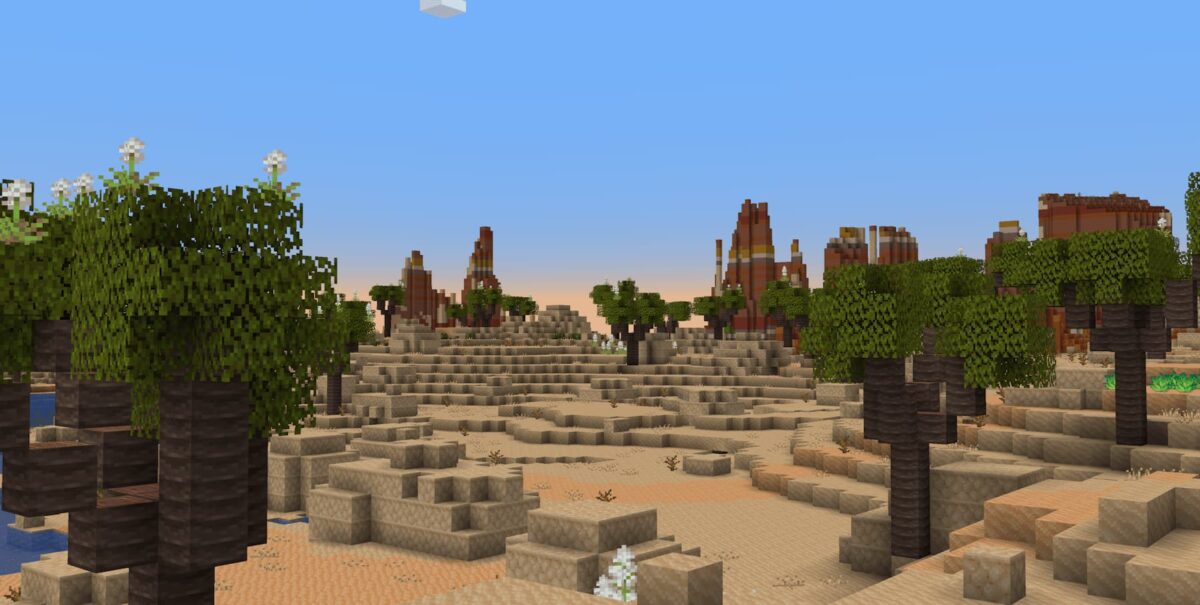 mod Minecraft Atmospheric illustrant des dunes arides bordant un biome de badlands érodées