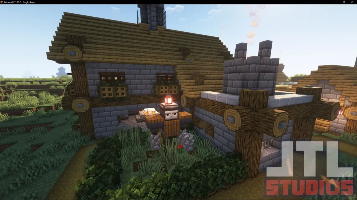 Maison de village des plaines retravaillée par le mod Minecraft Better Villages avec détails architecturaux en bois et pierre
