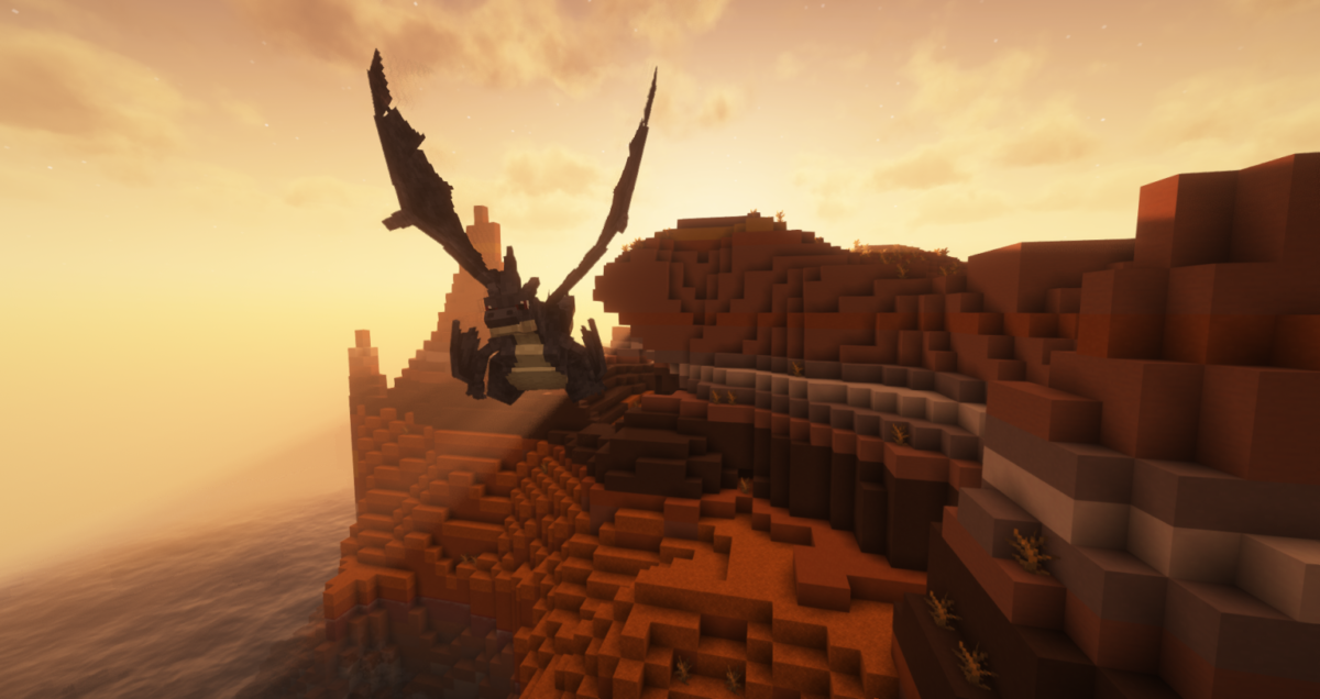 Méga-Dracaufeu Y en vol au-dessus d’un relief côtier au coucher du soleil dans le mod Minecraft Cobblemon: Mega Showdown.