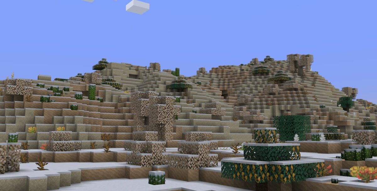mod Minecraft Atmospheric présentant un biome snowy scrubland aux collines enneigées et à la végétation rare