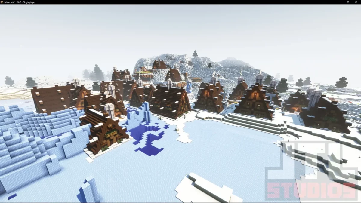 Village enneigé réaménagé par le mod Minecraft Better Villages avec maisons en bois sombre intégrées à un biome gelé