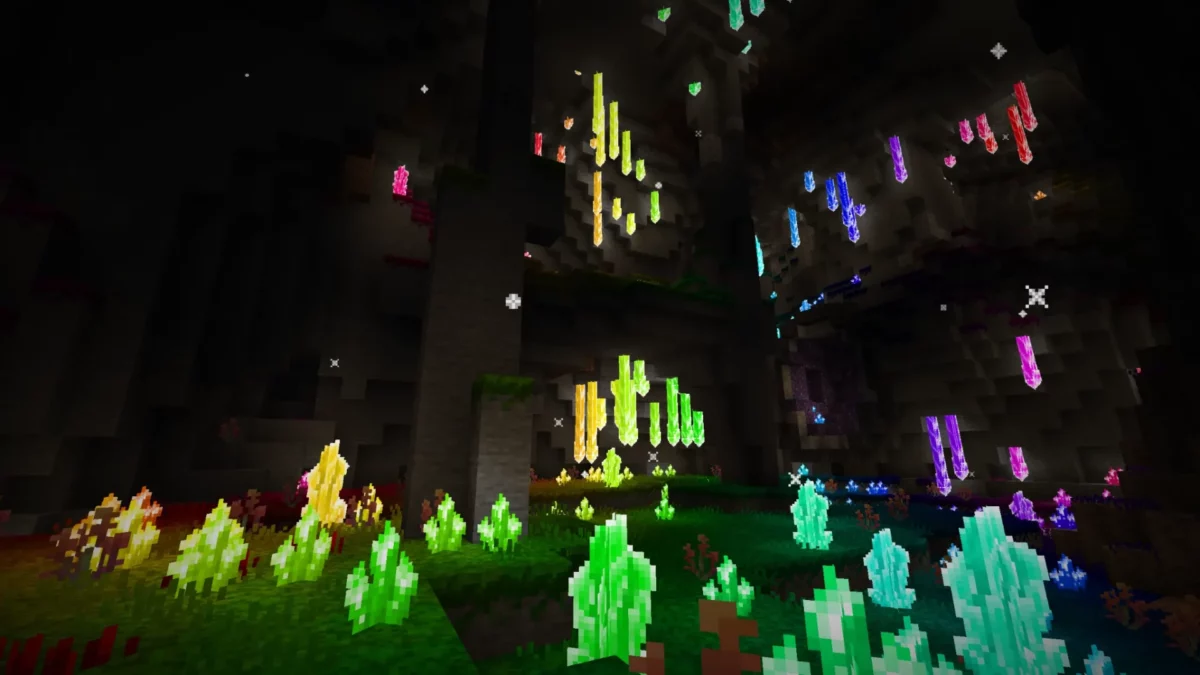 Gouffre souterrain aux cristaux multicolores lumineux généré par le mod Minecraft Regions Unexplored, avec relief vertical et ambiance minérale.