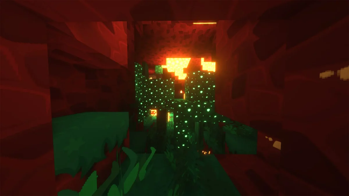 pack de texture Minecraft SimonKraft montrant une grotte rouge avec végétation lumineuse verte et éclairage chaud