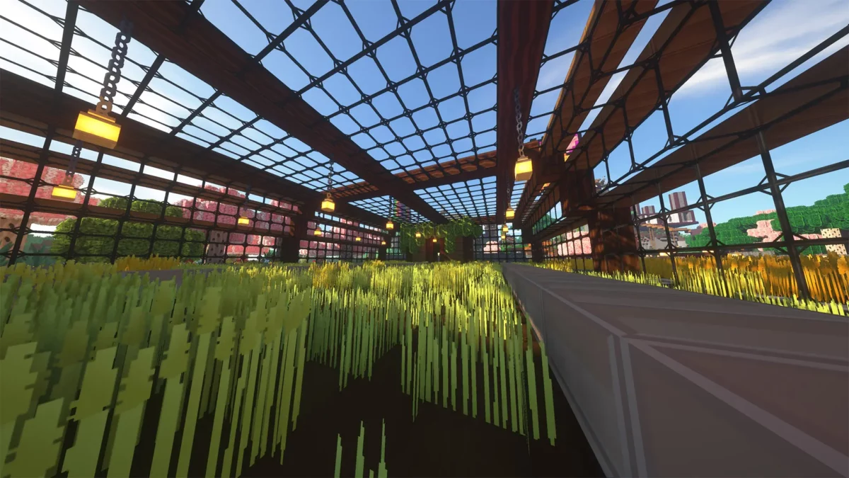 pack de texture Minecraft SimonKraft présentant une serre en verre avec cultures de blé et lanternes suspendues