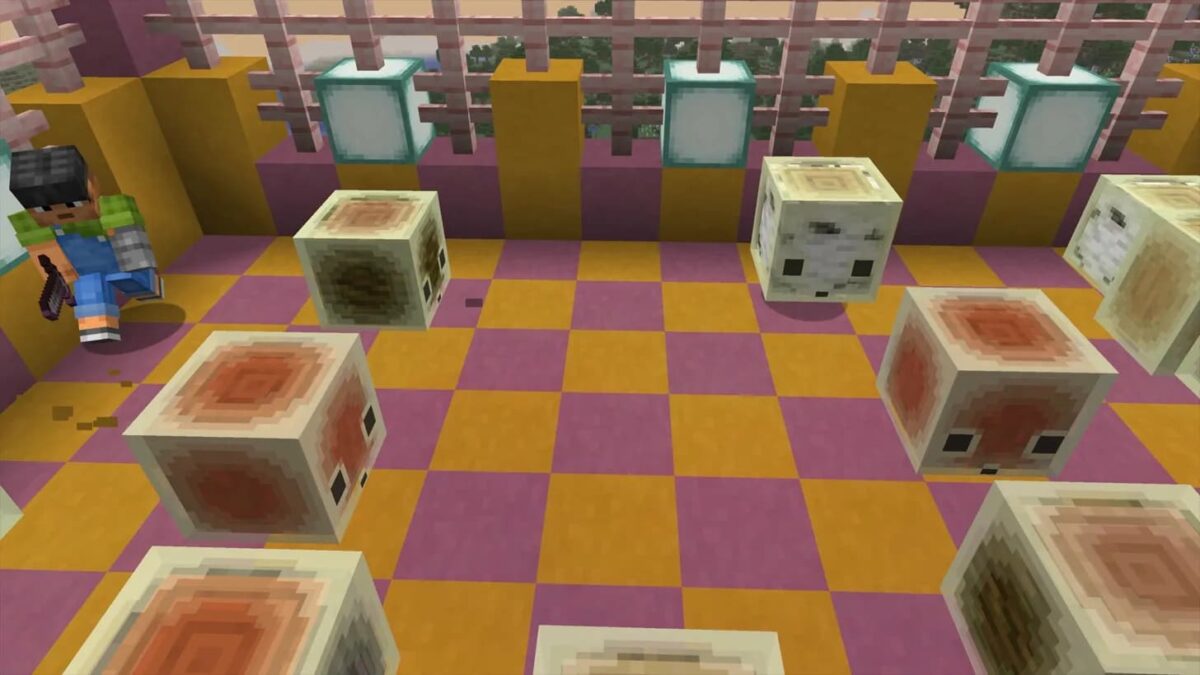 Un joueur fait face à plusieurs sulfur cubes aux textures différentes, dispersés sur un sol en damier rose et orange