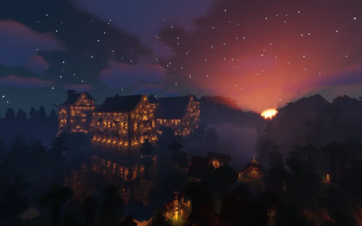 mod Minecraft The Lost Castle château illuminé de nuit sous un ciel étoilé et un coucher de soleil rougeoyant