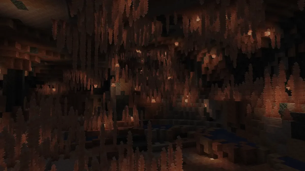 mod Minecraft Galosphere immersion dans les Pink Salt Caves avec stalactites de sel rose au plafond et bassin sombre