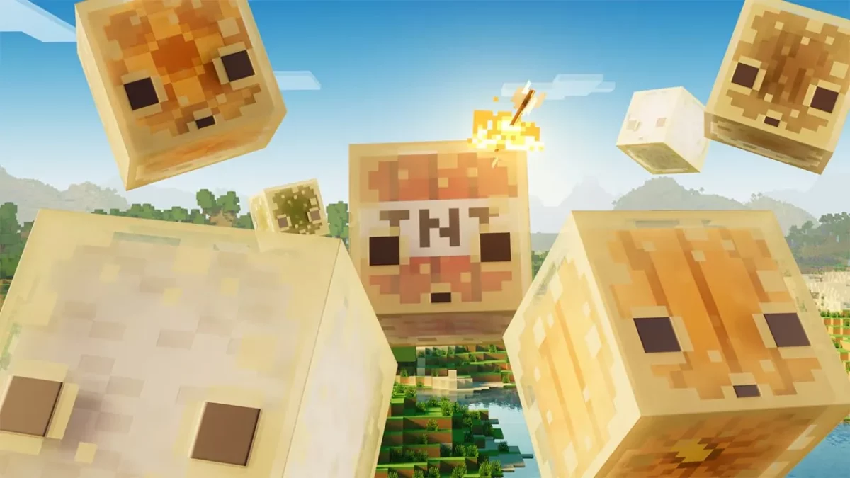Gros plan sur plusieurs cubes de soufre bondissant dans les airs dans Minecraft, dont un chargé de TNT au centre