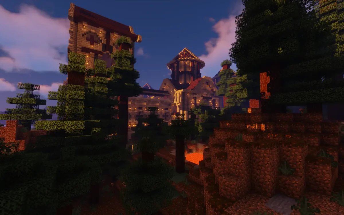 mod Minecraft The Lost Castle château au crépuscule entouré de forêts denses et d'une coulée de lave