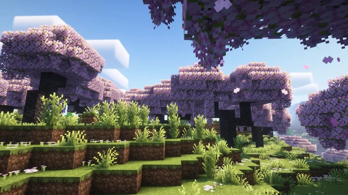 pack de texture Minecraft Enhanced cerisiers aux feuillages roses suspendus surplombant un paysage vallonne ensoleille