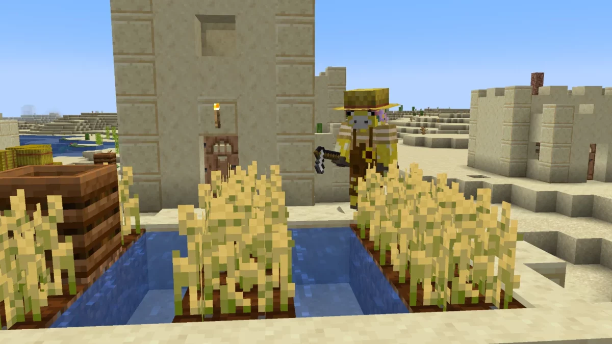 mod Minecraft Scorchful personnage portant un chapeau de soleil dans une ferme de village
