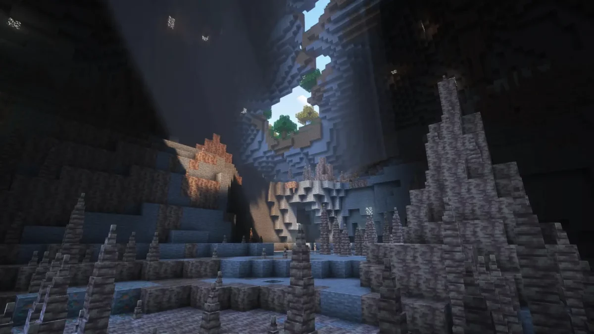 pack de texture Minecraft Enhanced grotte sombre herissee de stalagmites de dripstone sous une ouverture vers le ciel