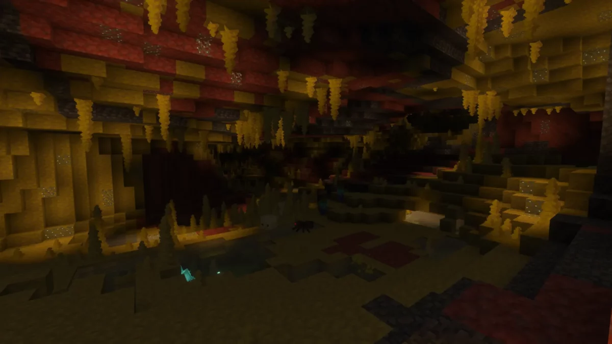 Vaste caverne de soufre dans Minecraft avec pointes de soufre suspendues au plafond de cinabre et une araignée des cavernes